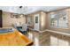 Inviting dining room featuring hardwood floors, modern lighting, and bright windows at 966 Crest Ridge Sw Dr, Marietta, GA 30060