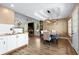 Open kitchen with wooden countertops, white cabinets, and seamless flow into the dining area at 966 Crest Ridge Sw Dr, Marietta, GA 30060