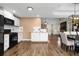 Modern kitchen featuring black appliances, white cabinetry, and an open layout to dining area at 966 Crest Ridge Sw Dr, Marietta, GA 30060