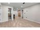 Spacious room with light hardwood floors, white walls, and multiple doorways at 966 Crest Ridge Sw Dr, Marietta, GA 30060
