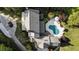 Aerial perspective showcases a private estate with swimming pool, meticulous landscaping, and circular driveway at 11355 Bowen Rd, Roswell, GA 30075
