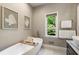 Bathroom with soaking tub, double vanity with marble countertop and towels at 11355 Bowen Rd, Roswell, GA 30075