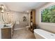 Serene bathroom features dual vanities, natural light, and a spa-like ambiance at 11355 Bowen Rd, Roswell, GA 30075
