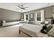 Neutral bedroom features natural light, ceiling fan, gray walls, and playful details for a calming atmosphere at 11355 Bowen Rd, Roswell, GA 30075