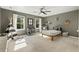 Bedroom with light gray carpet, ceiling fan and view of the yard at 11355 Bowen Rd, Roswell, GA 30075