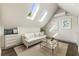 Bonus room with hardwood floors, three skylights, and a vaulted ceiling at 11355 Bowen Rd, Roswell, GA 30075