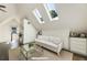 Bonus room with hardwood floors, three skylights, and a vaulted ceiling at 11355 Bowen Rd, Roswell, GA 30075