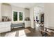 Bright breakfast nook with white cabinets, granite counters, bench seating, and outdoor views at 11355 Bowen Rd, Roswell, GA 30075