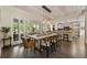 Bright dining area with wooden table, modern chairs, and sliding glass doors to the outdoor patio at 11355 Bowen Rd, Roswell, GA 30075