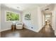 Inviting hallway with hardwood floors, large windows, and a cozy reading nook at 11355 Bowen Rd, Roswell, GA 30075