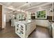 Spacious kitchen with double island, granite countertops, stainless steel appliances, and hardwood floors at 11355 Bowen Rd, Roswell, GA 30075