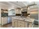 Modern kitchen featuring white cabinets, stainless steel appliances, granite countertops and dark backsplash at 11355 Bowen Rd, Roswell, GA 30075