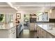 Bright kitchen with granite countertops, stainless steel appliances, and a view of the outdoor patio at 11355 Bowen Rd, Roswell, GA 30075