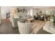 Inviting living room seamlessly connects to dining space; neutral tones and natural light at 11355 Bowen Rd, Roswell, GA 30075