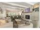Open-concept living room showcasing fireplace, built-in cabinets and connected dining space at 11355 Bowen Rd, Roswell, GA 30075