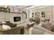 Spacious living room boasts a painted brick fireplace, built-ins, and ample seating at 11355 Bowen Rd, Roswell, GA 30075