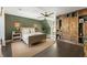 The main bedroom boasts a custom built-in wardrobe, ceiling fan, and hanging swing chair by the window at 11355 Bowen Rd, Roswell, GA 30075