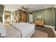 The spacious bedroom showcases custom built-ins, dark wood floors, and an accent wall at 11355 Bowen Rd, Roswell, GA 30075