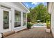 Deck leading to an inviting backyard swimming pool and lounging area at 11355 Bowen Rd, Roswell, GA 30075