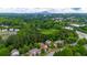 An aerial view of a neighborhood with mature trees and a glimpse of the city skyline in the distance at 1731 Pryor Sw Rd # 109, Atlanta, GA 30315