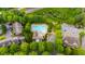 Overhead view of a community pool surrounded by trees, with nearby condos at 1731 Pryor Sw Rd # 109, Atlanta, GA 30315