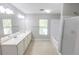 Bathroom features dual sink vanity, large mirror, a window, and a shower/tub combination at 1731 Pryor Sw Rd # 109, Atlanta, GA 30315