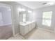 Bright bathroom featuring a double sink vanity, tile flooring, and natural light at 1731 Pryor Sw Rd # 109, Atlanta, GA 30315
