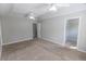 Bright bedroom featuring tray ceilings, ceiling fans, and walk-in closet at 1731 Pryor Sw Rd # 109, Atlanta, GA 30315