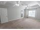 Neutral bedroom with large windows, ceiling fans, and walk-in closets at 1731 Pryor Sw Rd # 109, Atlanta, GA 30315