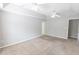 Large bedroom featuring tray ceiling, fan, neutral colors, and carpet at 1731 Pryor Sw Rd # 109, Atlanta, GA 30315