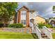 Charming multi-level home featuring a mix of brick and siding with stone retaining wall and landscaped lawn at 1731 Pryor Sw Rd # 109, Atlanta, GA 30315