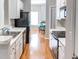 Well-lit kitchen features stainless steel appliances, white cabinets, and hardwood floors at 1731 Pryor Sw Rd # 109, Atlanta, GA 30315