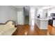 Cozy living room with hardwood floors, stairway and view into the kitchen at 1731 Pryor Sw Rd # 109, Atlanta, GA 30315