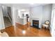 Living room with hardwood flooring, fireplace, stairway and view into the kitchen at 1731 Pryor Sw Rd # 109, Atlanta, GA 30315