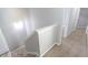 Carpeted staircase featuring gray walls, white trim, and a hallway at 1731 Pryor Sw Rd # 109, Atlanta, GA 30315