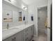 Well-lit bathroom with a double vanity, a large mirror, and a tiled shower, stylish and practical at 4735 Cambridge Trce, Atlanta, GA 30338
