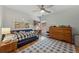 Bright bedroom featuring a daybed, workspace, and a large window, perfect for a growing  at 4735 Cambridge Trce, Atlanta, GA 30338
