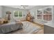 Comfortable bedroom with two windows, a ceiling fan, and hardwood floors creates a cozy space at 4735 Cambridge Trce, Atlanta, GA 30338