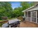 Spacious wooden deck features a grill and outdoor cooking space, perfect for summer barbecues at 4735 Cambridge Trce, Atlanta, GA 30338