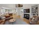 Spacious living room with hardwood floors, fireplace, and open layout to the kitchen, perfect for entertaining at 4735 Cambridge Trce, Atlanta, GA 30338