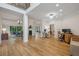 Open-concept home with hardwood floors, fireplace, and a seamless flow to the dining and office areas at 4735 Cambridge Trce, Atlanta, GA 30338