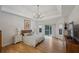 Bright main bedroom with a tray ceiling, wood floors, and access to an outdoor deck at 4735 Cambridge Trce, Atlanta, GA 30338
