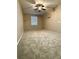 A spacious bedroom with a ceiling fan and natural lighting from the window at 4831 Oak Path, Stone Mountain, GA 30088