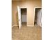 Bedroom with neutral carpet, showcasing the closet and ensuite bathroom access at 4831 Oak Path, Stone Mountain, GA 30088