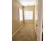 Cozy bedroom with carpeted floors, a window, and neutral paint at 4831 Oak Path, Stone Mountain, GA 30088