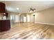 An open-concept living space with wood-look floors, neutral paint, and ample natural light at 4831 Oak Path, Stone Mountain, GA 30088