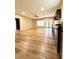 Living and dining area with an open concept layout, plus new vinyl floors and lots of light at 4831 Oak Path, Stone Mountain, GA 30088
