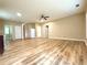 An open-concept living space with wood-look floors, neutral paint, and ample natural light at 4831 Oak Path, Stone Mountain, GA 30088