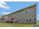 A serene backyard with a patio set and red umbrella, ideal for enjoying the outdoors at 760 King Sword Ct, Mableton, GA 30126