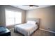 Cozy bedroom with neutral walls, a ceiling fan and a bright window that allows natural light at 760 King Sword Ct, Mableton, GA 30126